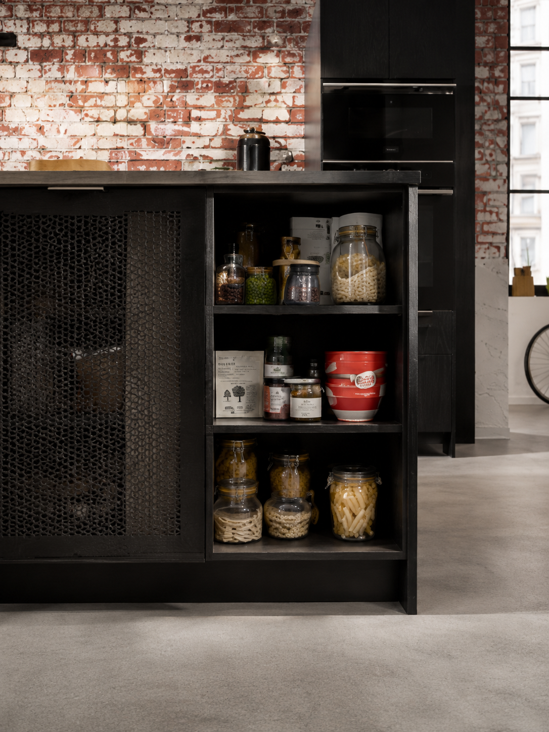 Dark pantry study with brick and blackened joinery — Dominus Kitchens