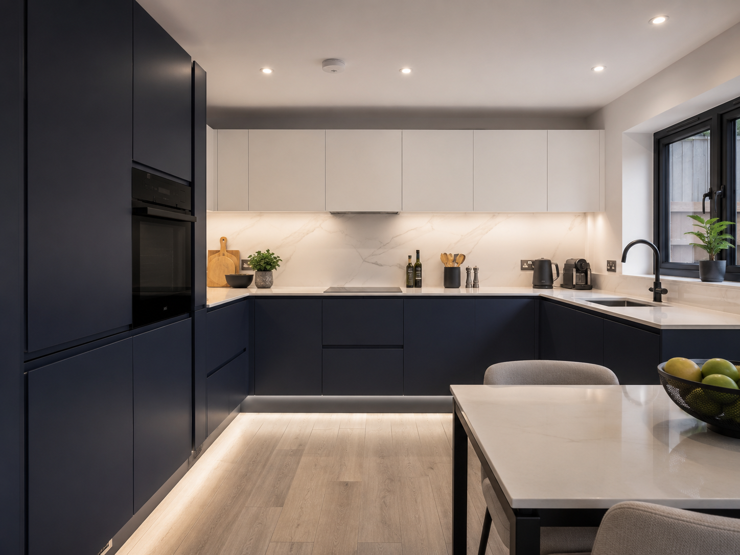 Contemporary navy kitchen with marble island and dining — Dominus Kitchens